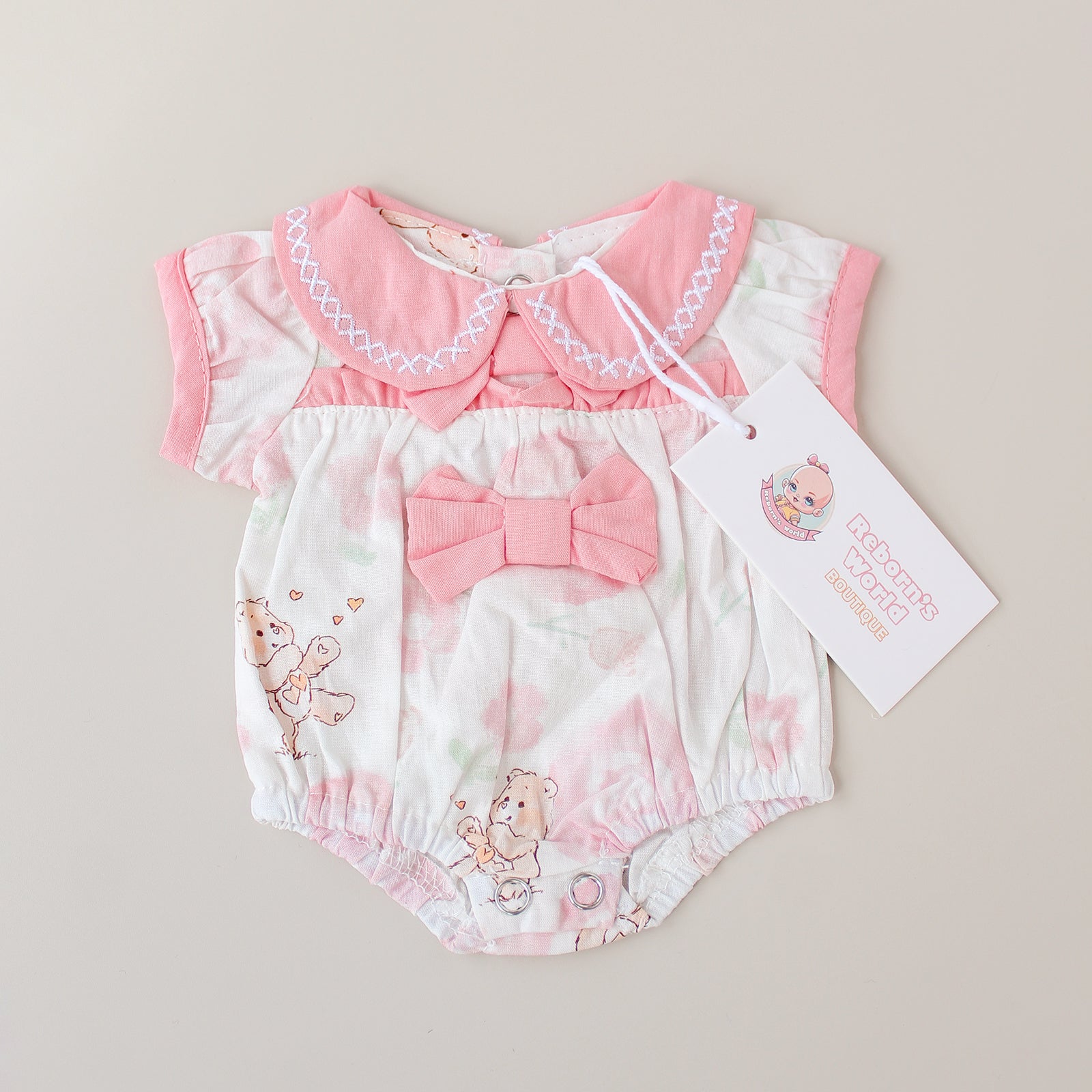 Piel rosa y divertida con mangas de corte original - Para bebés reborn de 36 a 45 cm