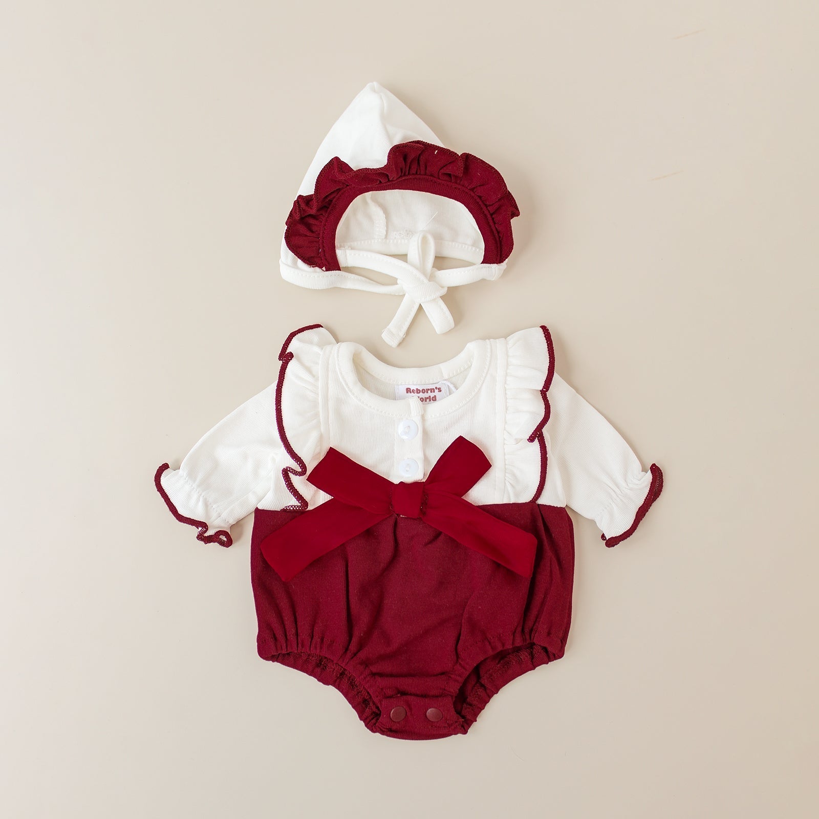 Piel con cuero ceremonial y capucha color burdeos – Para bebés reborn de 40 a 48 cm